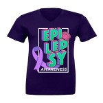 A purple graphic t-shirt with a large white box on it. In the box is the phrase "Epilepsy Awareness". The word 'Epilepsy' is written in teal 3D text separated onto three lines and 'Awareness' is written in white text. The graphic also includes a purple awareness ribbon in the bottom left corner and a pink brain in the top right corner.
